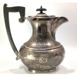 A 'Year of the Three Kings' silver hotwater jug of oval-section baluster form, with hinged cover,