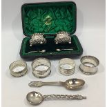 A cased pair of silver open salts by William M Hayes, with spoons, hallmarked Birmingham, 1900,