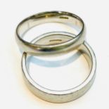Two platinum wedding rings, weighing a total of 19.0 grams, both rings finger size T.