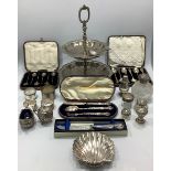 A cased set of six silver coffee spoons with bean finials, together with another cased set of six