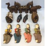 A collection of Near-Eastern and North African carved figures including a four-piece carved and