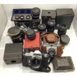 A quantity of cameras and camera equipment including a Rolleiflex SL35, Zeiss Contina, Brownie box