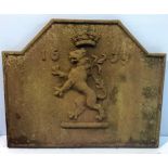 A cast iron fireback with central crowned lion rampant and the dated 1639