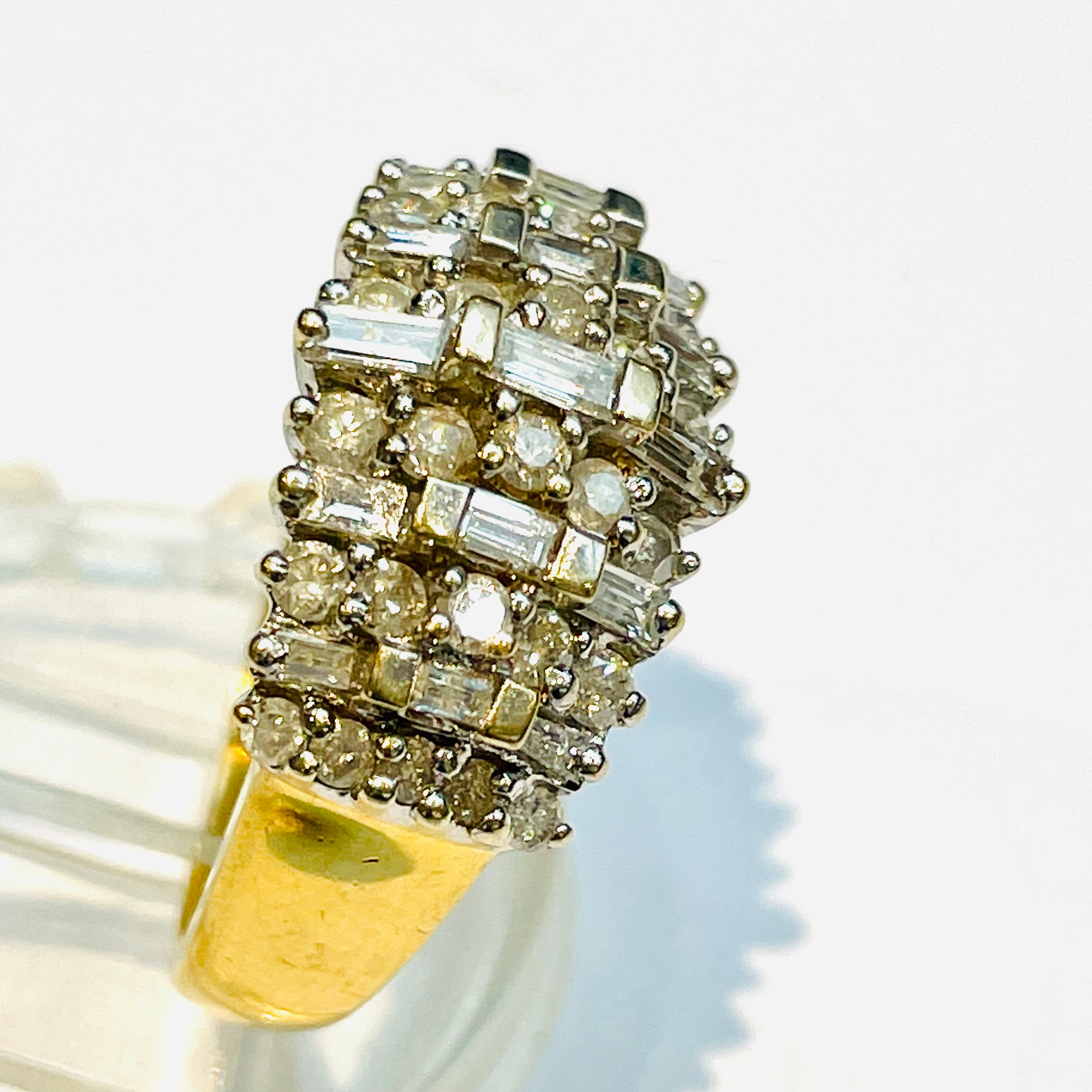 An 18ct yellow gold diamond dress ring, set with 28 x round brilliant cut diamonds and 15 baguette - Image 2 of 3