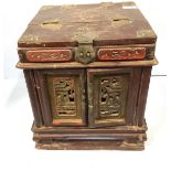 A late 19th/early 20th century Chinese carved wood and lacquered travelling vanity box, with