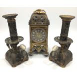 A brass three-piece clock garniture, the clock with circular brass dial and enamelled Roman numerals