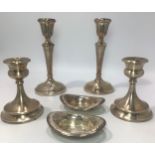 A pair of loaded silver candlesticks by D Bros, hallmarked Birmingham, 1970, together with a pair of