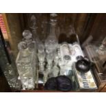 Four various cut glass decanters, together with some drinking glasses, two sets of glass knife