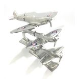 Three various aluminium Spitfire aeroplane desk ornaments, raised on rectangle bases, largest 35 x