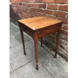 A small mahogany side table with hinged, folding top and single frieze drawer, raised on turned
