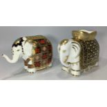 Two Royal Crown Derby paperweights comprising 'Aura' elephant and another elephant, exclusive to