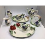 A Franz porcelain 'Hummingbird' patterned tea set comprising teapot, milk, sugar, cup, saucer and