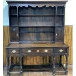A 20th Century Anglo-South African stained hardwood dresser, the top with open shelves and two