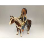 A Beswick pottery Native American / American Indian Chief mounted on a Skewbald horse, No. 1391,