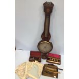 A banjo aneroid barometer with paper label verso 'George Lee & Son Optical & Nautical Instruments