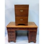 A leather topped kneehole desk, together with a two drawer campaign style filing cabinet