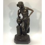 A Bronze figure of a Grecian maiden with Amphora vase resting on short fluted column, signed '