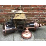 A pair of Victorian 'style' circular copper wall-mounted street lights with metal mounting brackets,