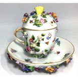 An 18th century Meissen porcelain cup and cover with saucer, all encrusted with flowers and