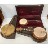 Three various banjo-ukulele in hard cases, all (as found)
