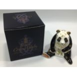 A Royal Crown Derby Imari Giant Panda paperweight with marks to base and gold stopper, 11cm high,