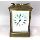 A brass-cased chiming carriage clock, with hour repeat button, and key, (A/F)