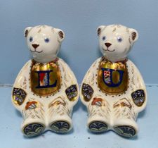 A pair of Royal Crown Derby Alphabet Bears, 'U' and 'L', with printed marks to base, gold stoppers