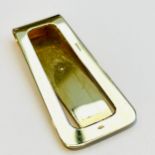 A 9ct yellow gold money clip, weighs 10.1 grams.