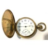 A gold-plated full-hunter pocket watch by Waltham, the white enamel dial with Arabic numerals