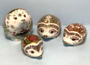 Four assorted Royal Crown Derby Hedgehog paperweights comprising 'Strawberry' the summer