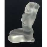 A Lalique 'Petit Nue Aphrodite' crystal glass figure of a kneeling nude female, with one arm bent