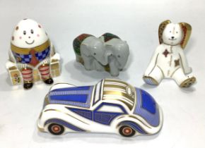Four assorted Royal Crown Derby paperweights, primarily from 'Treasures of Childhood' series,