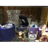 Two shelves of cut glass including a large heavy vase, drinking glasses, posy vases, fruit bowls,