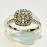 A 14ct white gold diamond ring set with 8 x round brilliant cut diamonds to the centre with a halo