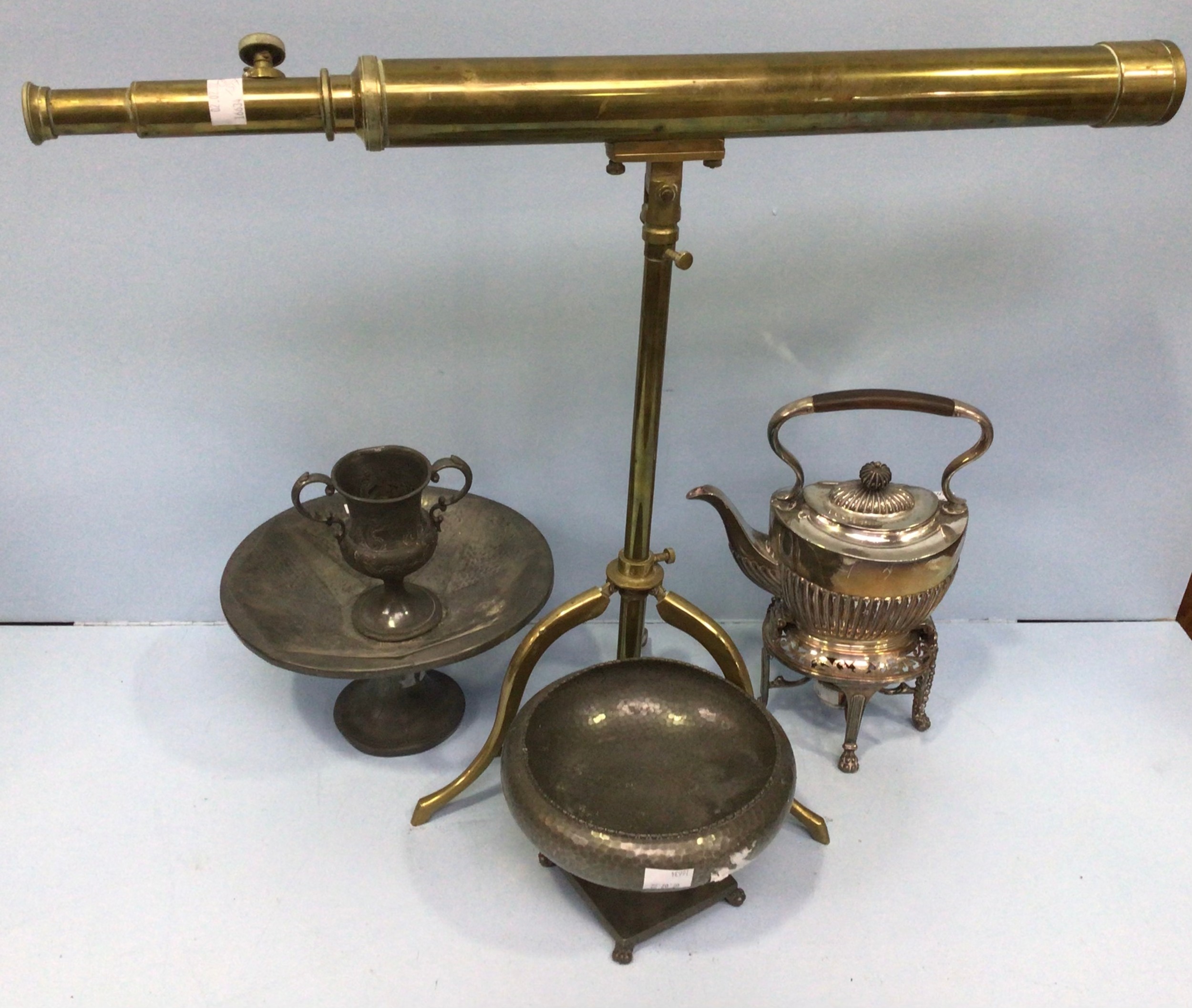 A reproduction brass telescope and tripod (af), together with a silver-plated kettle with stand