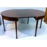 A George III mahogany D-ends dining table, comprising a pair of demi-lune pier tables, with extra