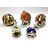 Five assorted Royal Crown Derby paperweights comprising 'Christmas Squirrel', limited edition 83/