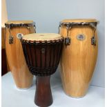 A pair of Natal Spirit Conga drums 10" and 11" in natural gloss finish with natural hide heads and