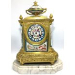 A 19th century French Ormolu and porcelain mantel clock in the Neo-Classical style, with eight-day