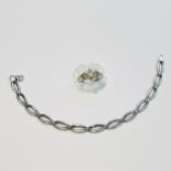 A 9ct white gold oval link bracelet, weighing 4.4 grams, together with a 9ct white gold dress ring