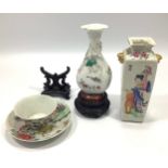 A Chinese famille rose small vase of compressed lotus section and baluster form, with moulded and