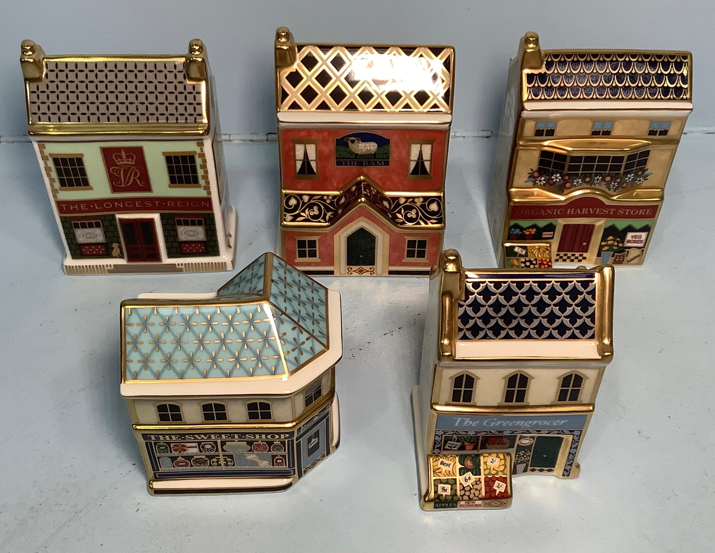 Five assorted Royal Crown Derby paperweights comprising 'The Organic Harvest Store' limited