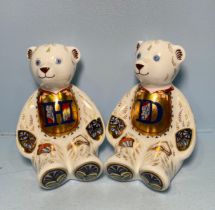A pair of Royal Crown Derby Alphabet Bears, 'D' and 'H', with printed marks to base, gold stoppers