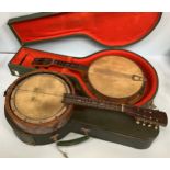 An 8-string Banjo-ukulele, 8" drum head, faux mother-of-pearl body (af) in hard green vinyl hard