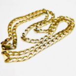 A 9ct yellow gold flat curb link chain, weighing 17.2 grams, measuring 22 inches in length.