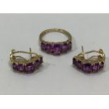 A 9ct gold dress ring set with five graduated amethyst coloured stones, ring size O, together with a