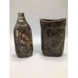 Two various pottery vases by Denise Wren, one of oval cylindrical form, the other of bottle form,