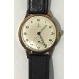 A gents 9ct gold Tudor wristwatch, the silvered dial with Arabic numerals denoting hours and