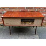 A 1950's/60's Westminster radiogram, housed in mahogany case, enclosing Monarch turntable, on turned