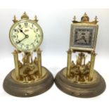 Two various German Schatz 400 Day Clocks, both with Arabic numerals denoting hours, raised on two